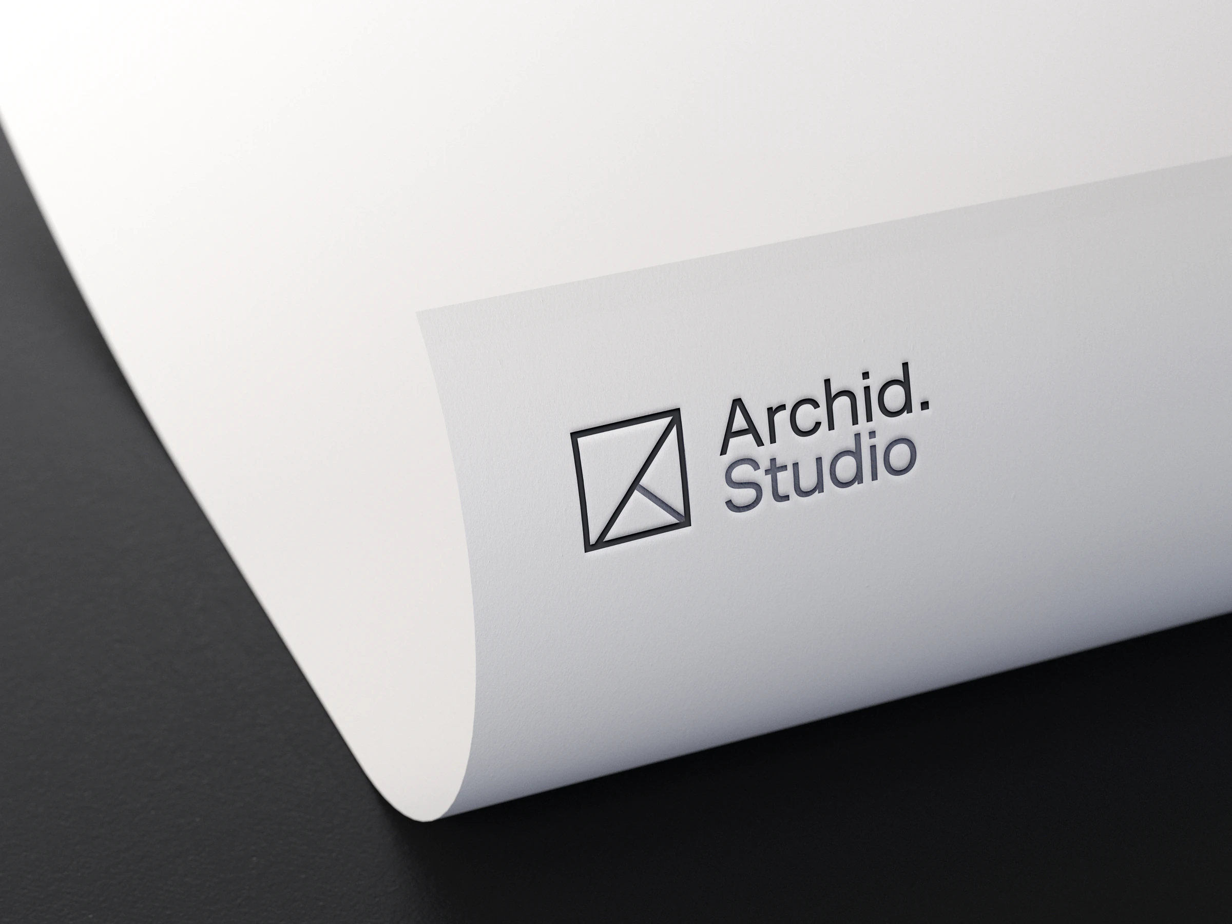 Blind embossed Archid Studio logo on white paper