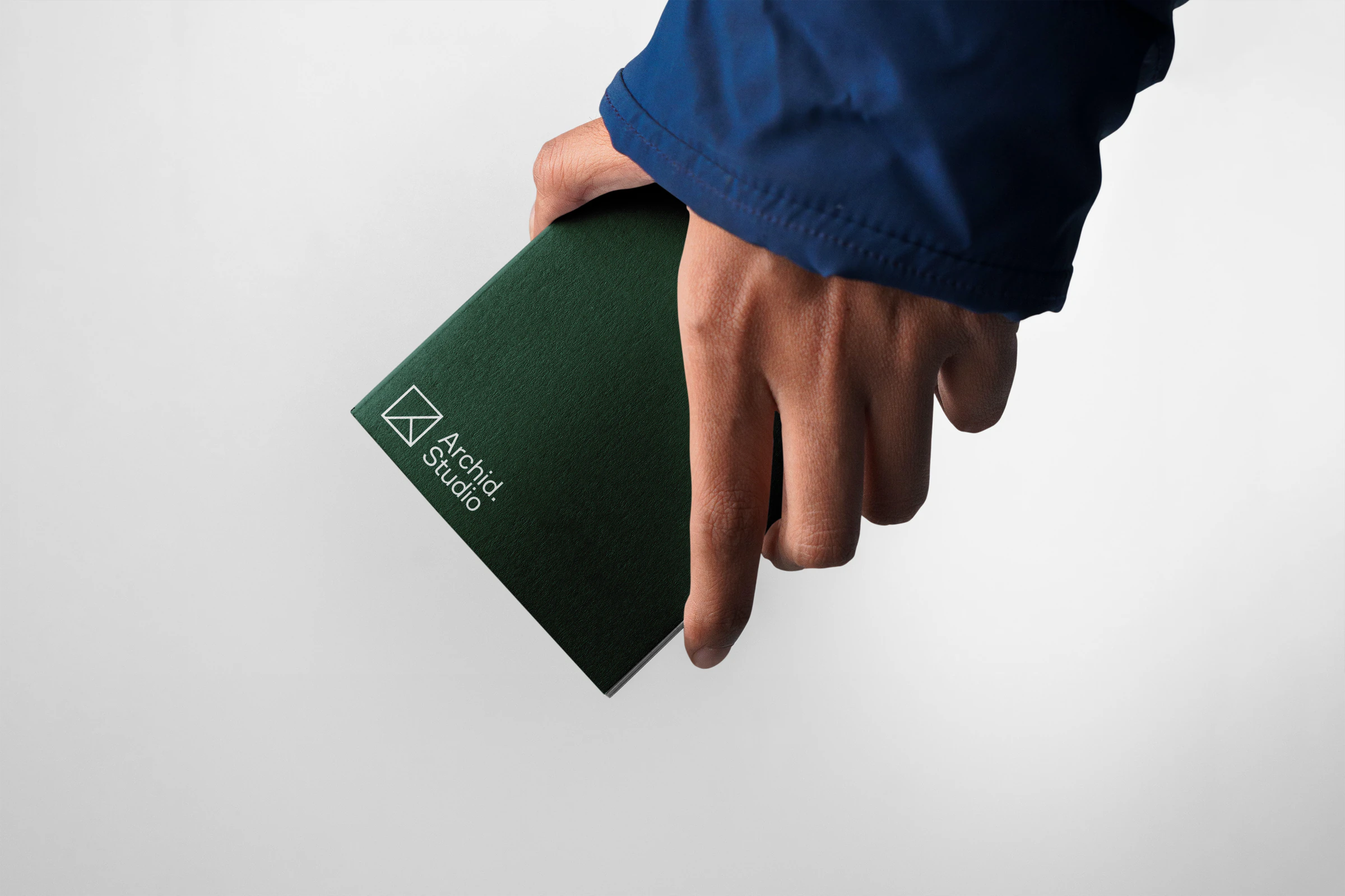 Green Archid notebook in hand