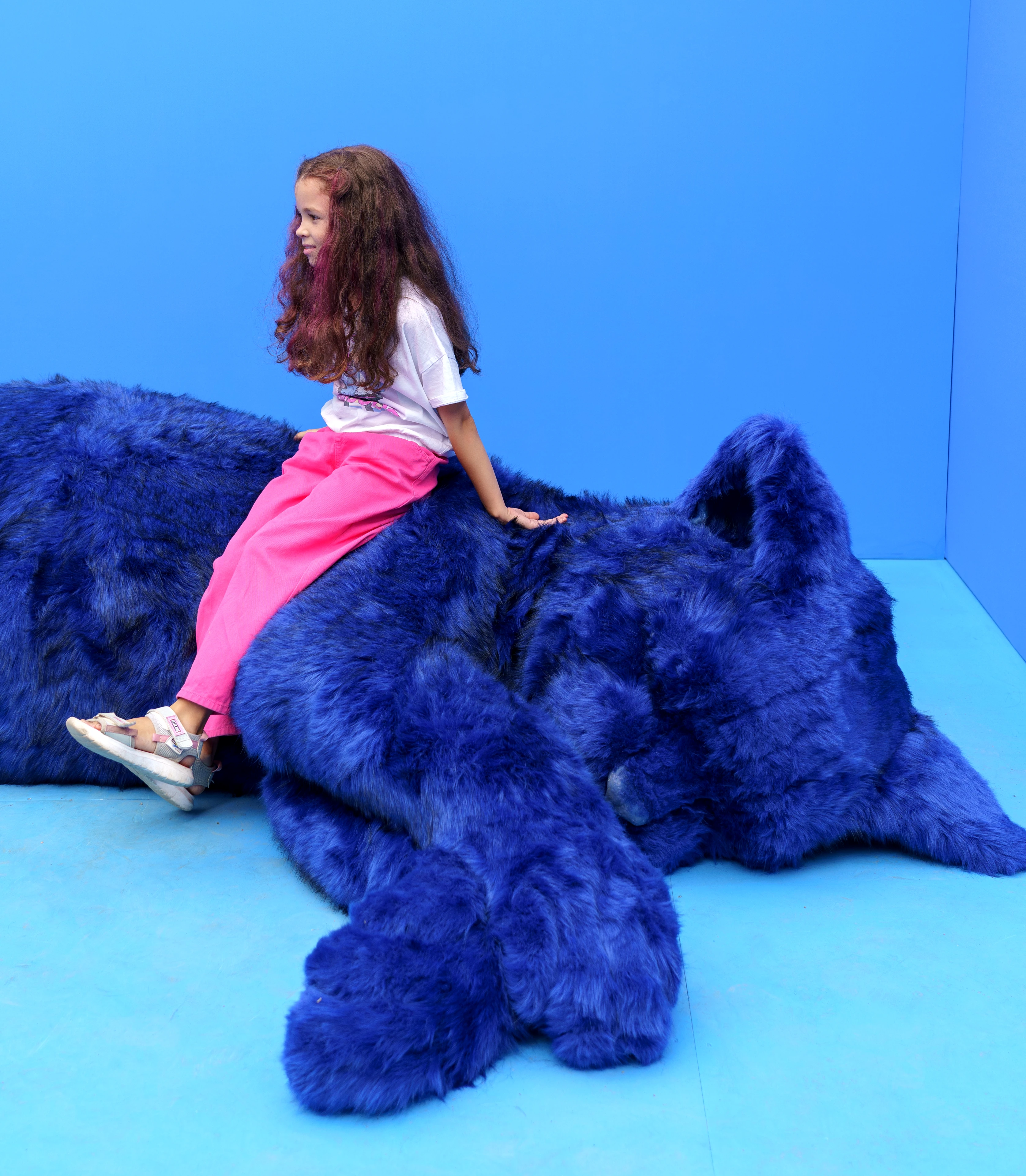 A girl on the giant cat