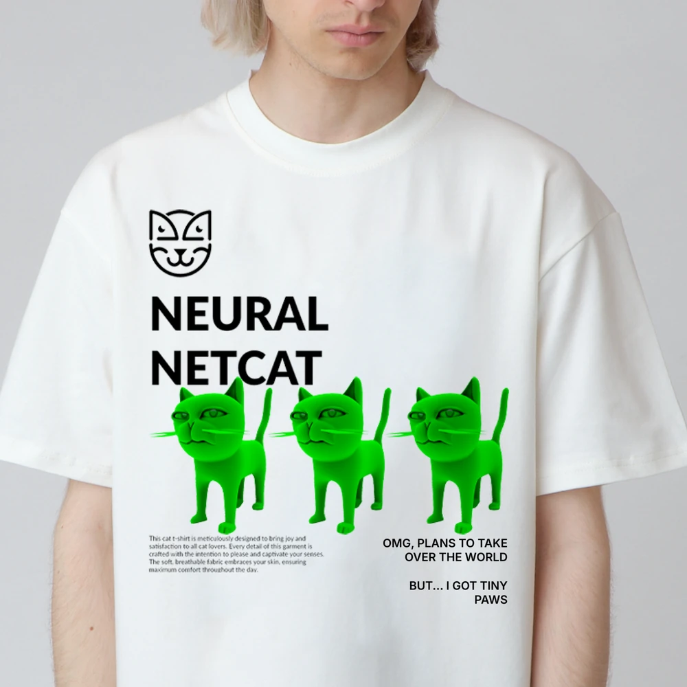 A white Netcat t-shirt with three green cats and the line Omg, plans to take over the world