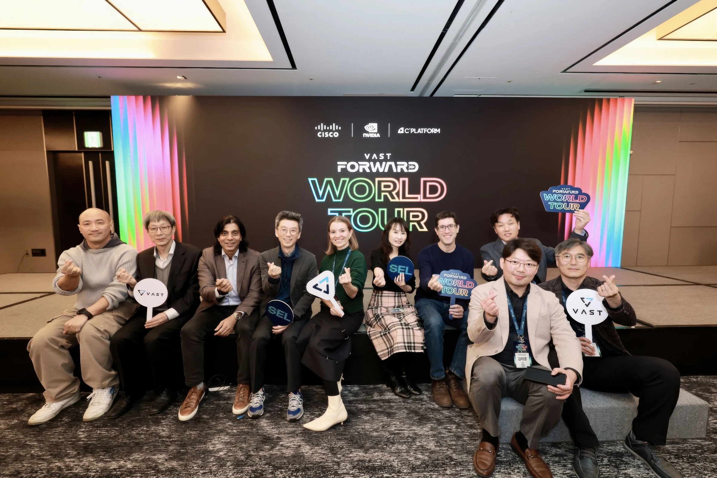 Attendees at the tour backdrop
